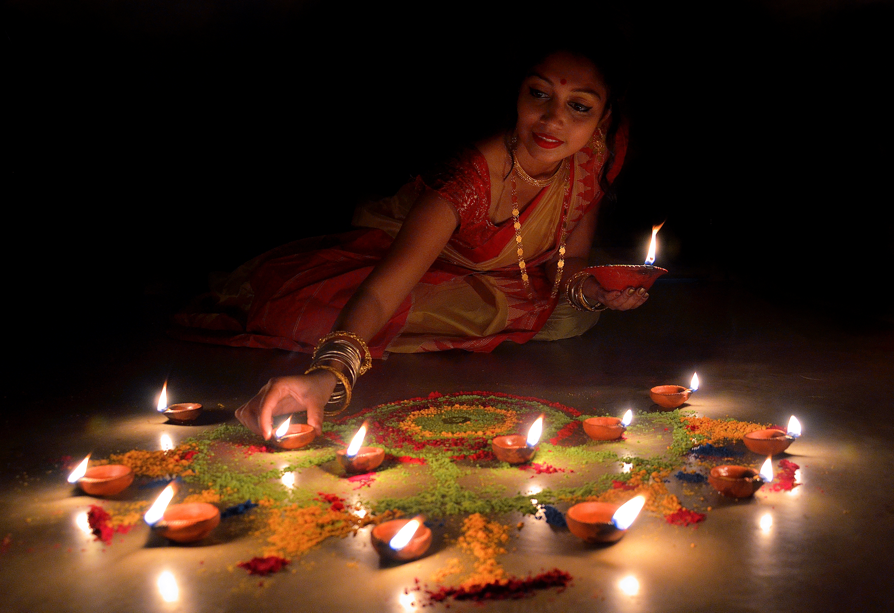 Creating a rangoli on your doorstep is a timeless Diwali tradition.