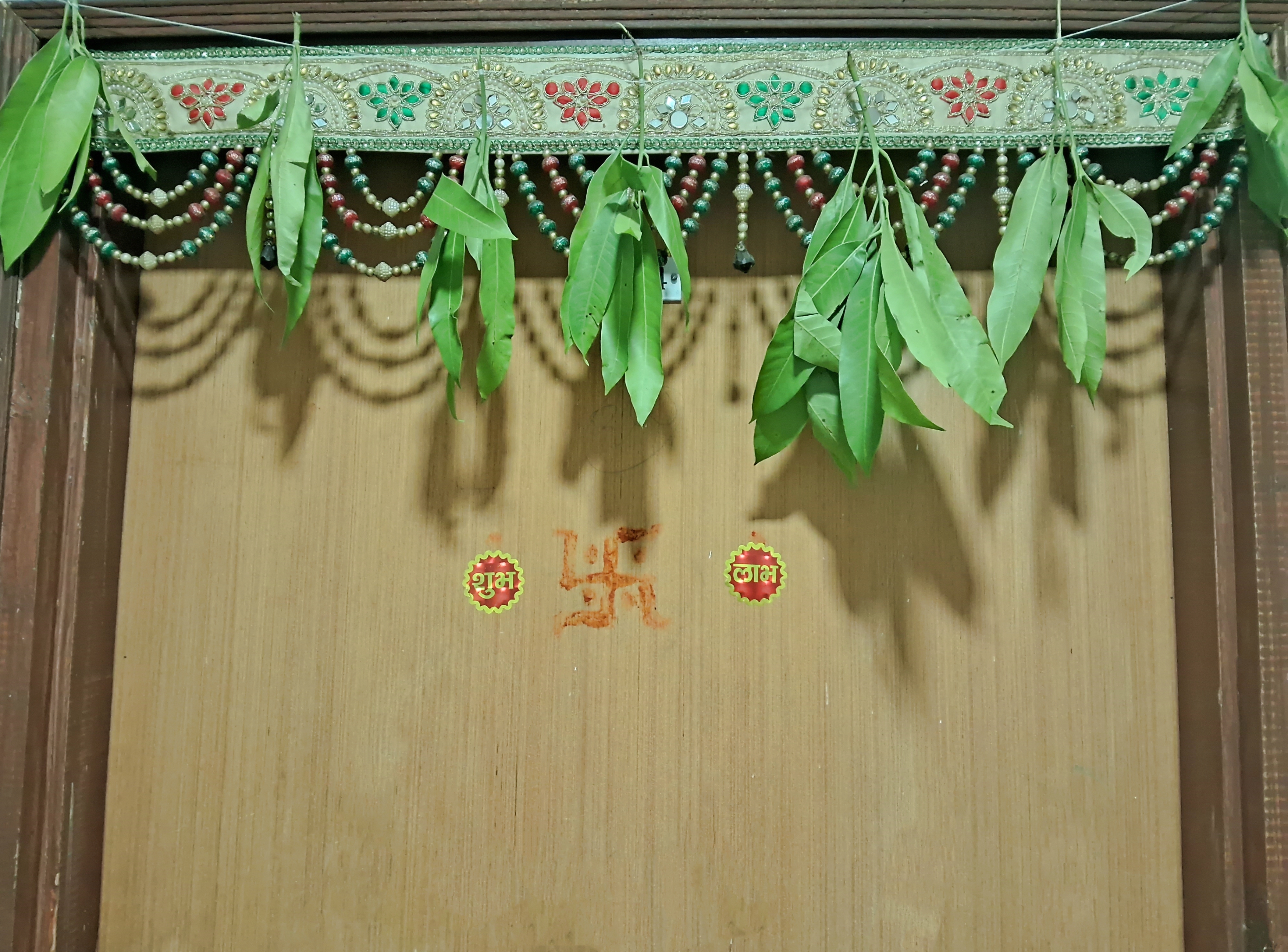 Decorated torans or garlands hanging for the main door are essential for Diwali.