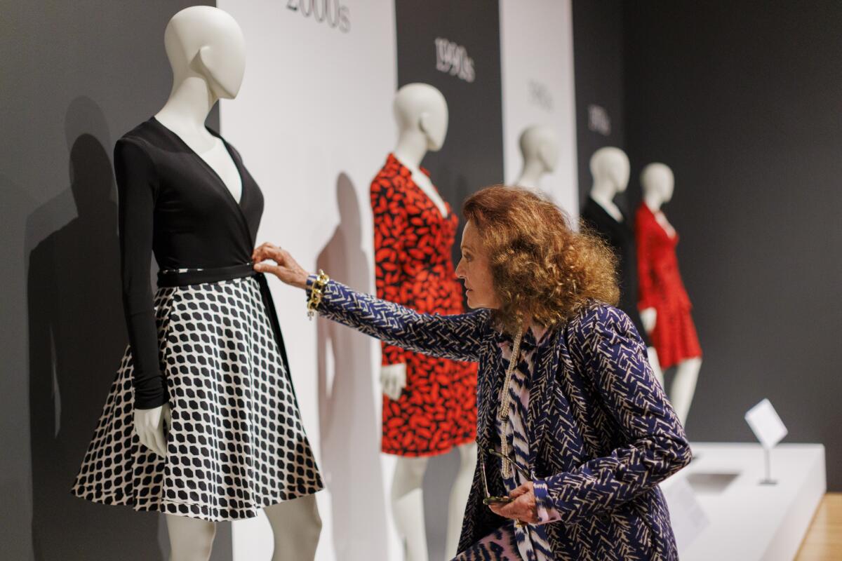 Diane von Furstenberg reviews the display of her wrap dresses through the decades.